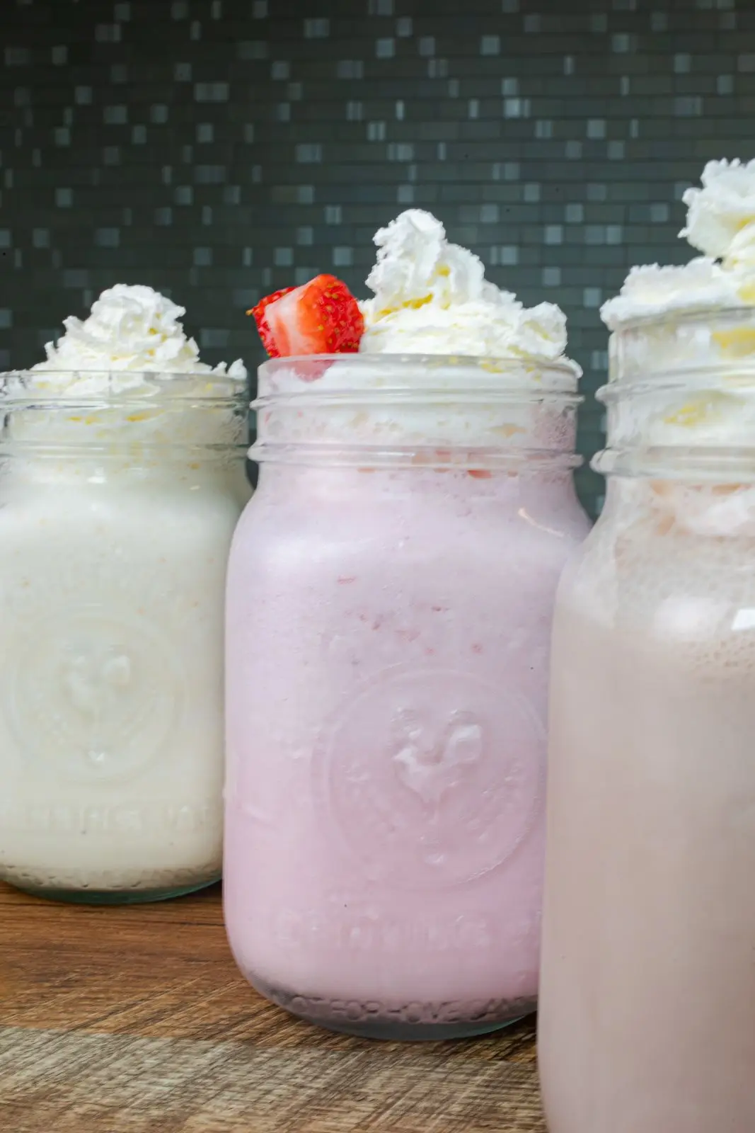 Hand-spun milkshakes in mason jars topped with whipped cream