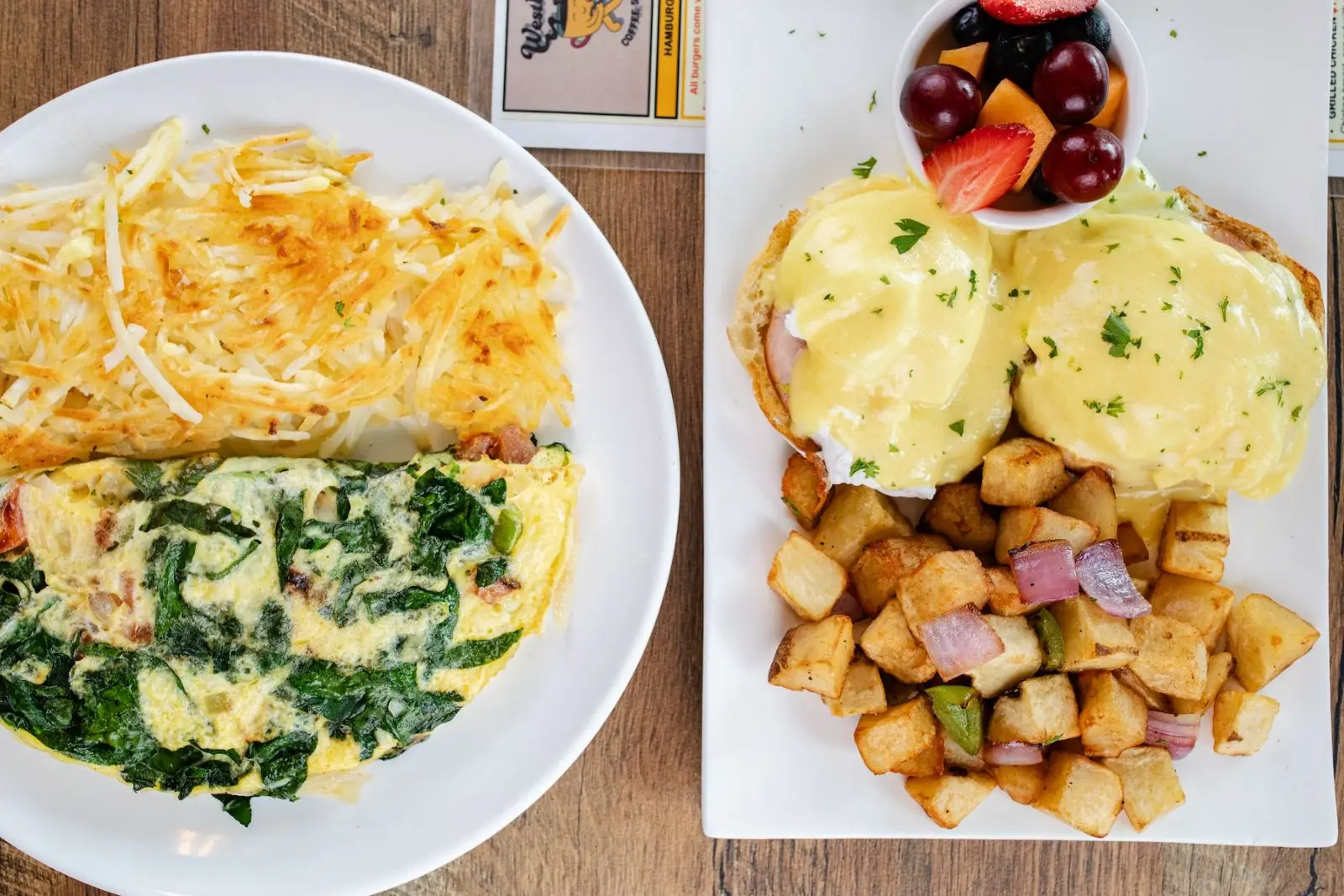 Spinach omelette and eggs Benedict plates
